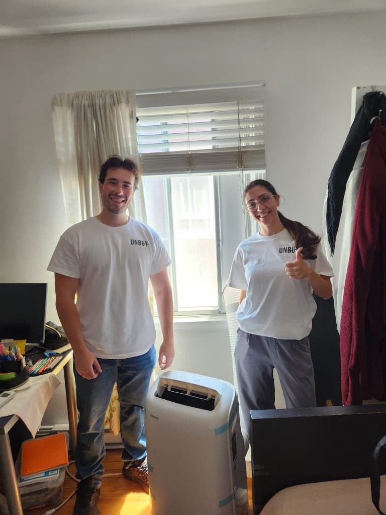 Liliya with her portable AC unit delivered and installed in Saint-Denis